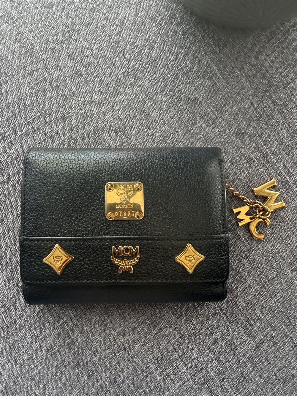 MCM Black Pebbled Leather Wallet with Gold Logo Hardware
